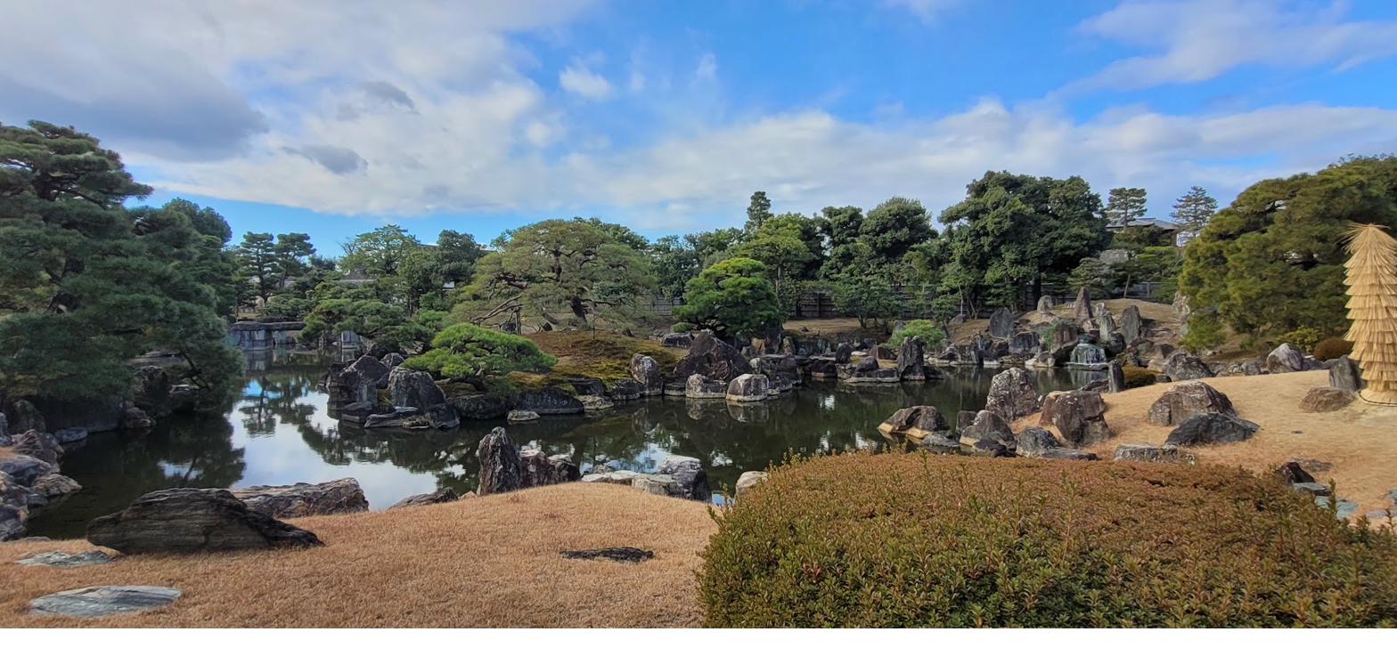 Classical Japanese garden — water, stone, and trained pines